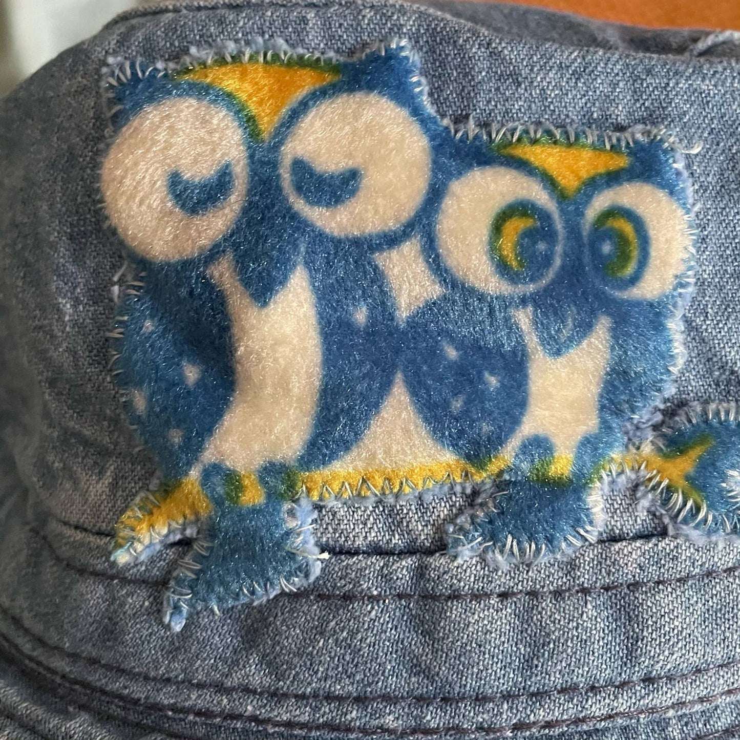 Upcycled 90s denim bucket hat with velveteen owl appliqué